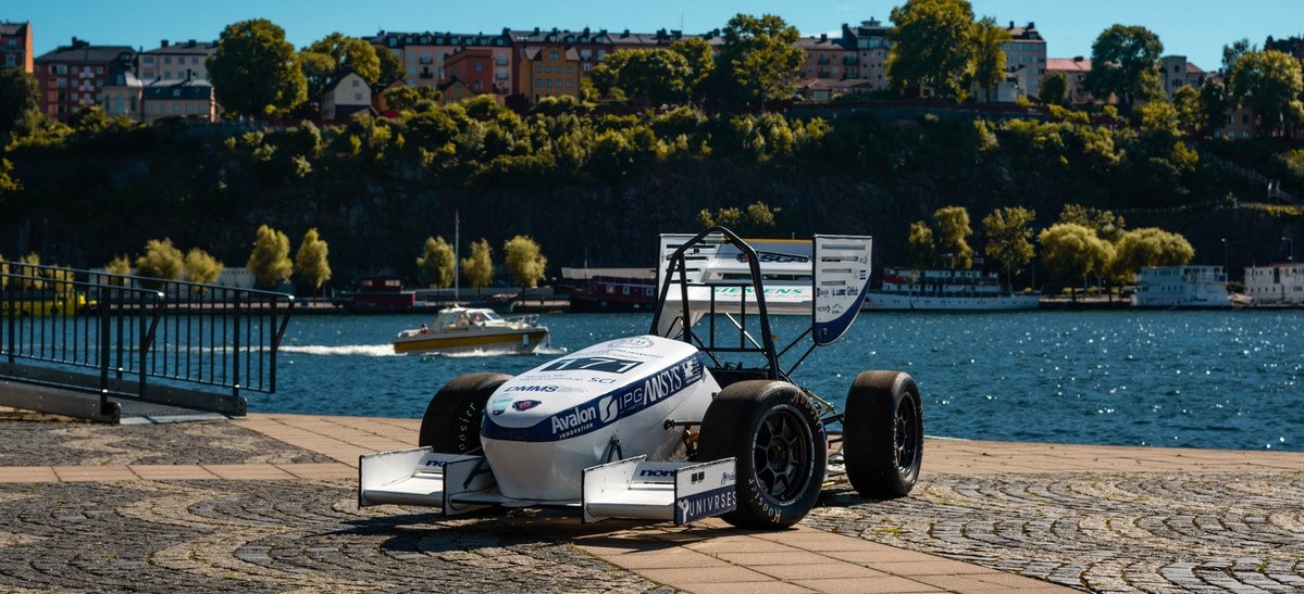 The formula student car at a dock.