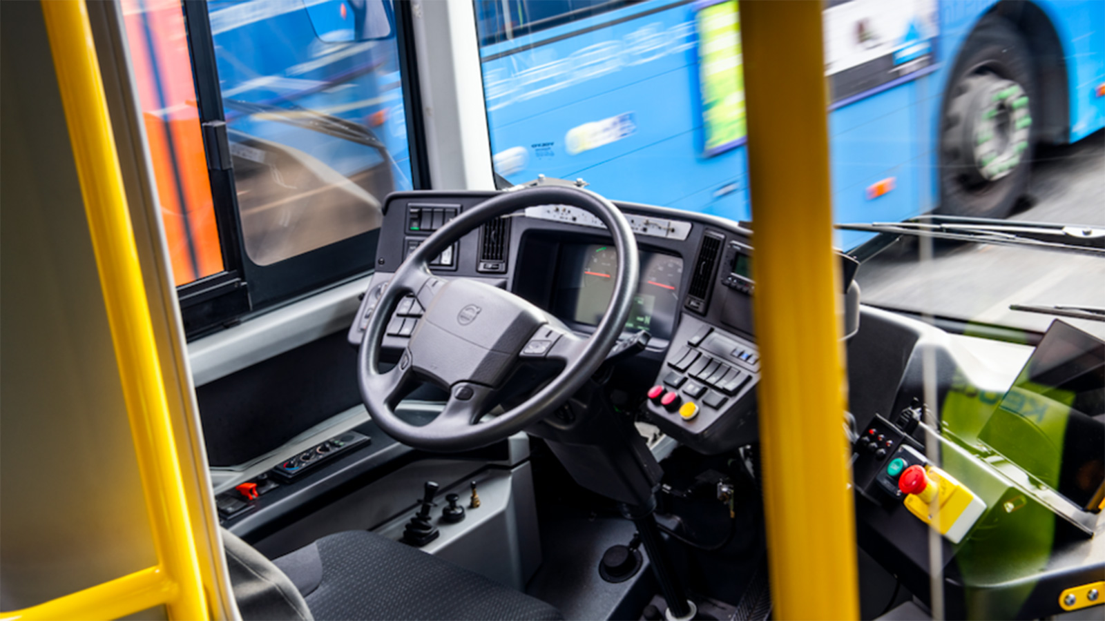 A steering wheel in a bus.