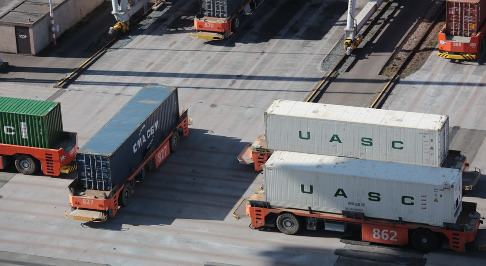 Autonomous trucks at a harbor.