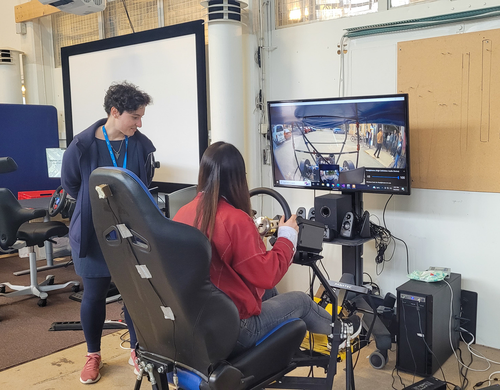 Woman testing a remote driving system.